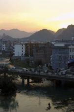 DeBao bridge over Jianhe River rushhour at sunset - Guangxi Province.jpg